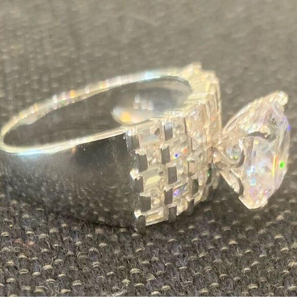 5.5 DEW  center stone with 3 rows of rounds . Rhodium plated . Size 10 - Picture 5 of 5